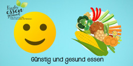 Lachender Smiley und Teller mit Gemüse und Obst vor blauem Hintergrund