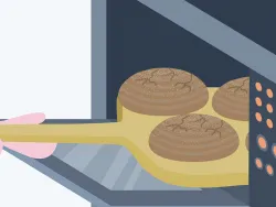 Jemand nimmt Brot aus dem Ofen