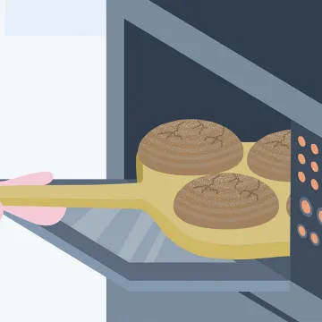 Jemand nimmt Brot aus dem Ofen